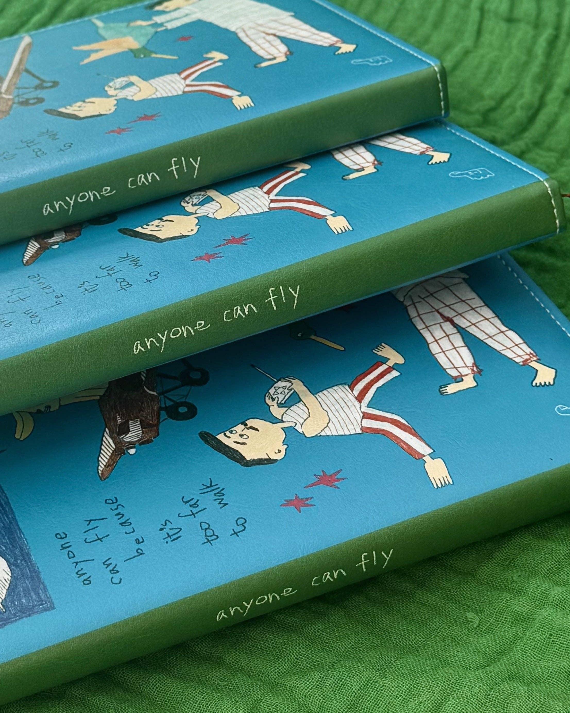 ‘Anyone can fly’ Cushion Cover Notebook