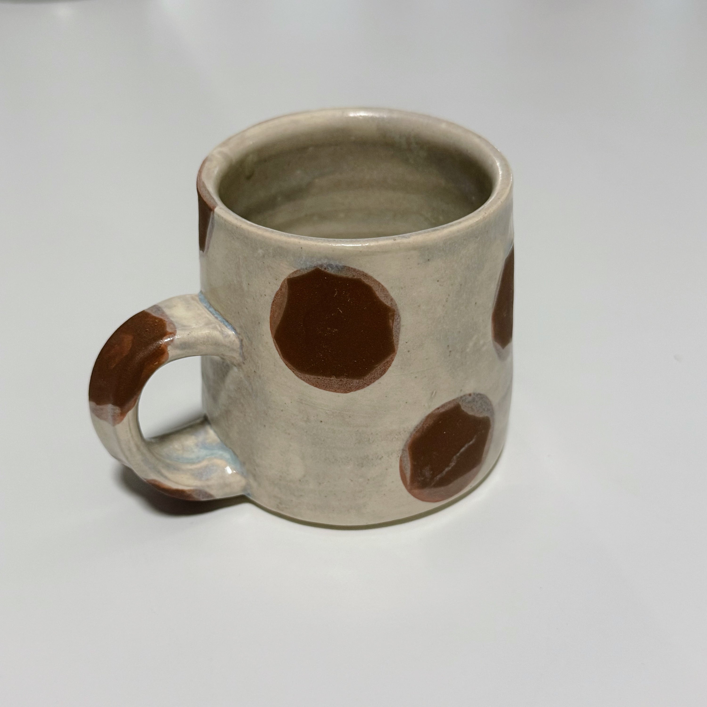 white polka dot mug