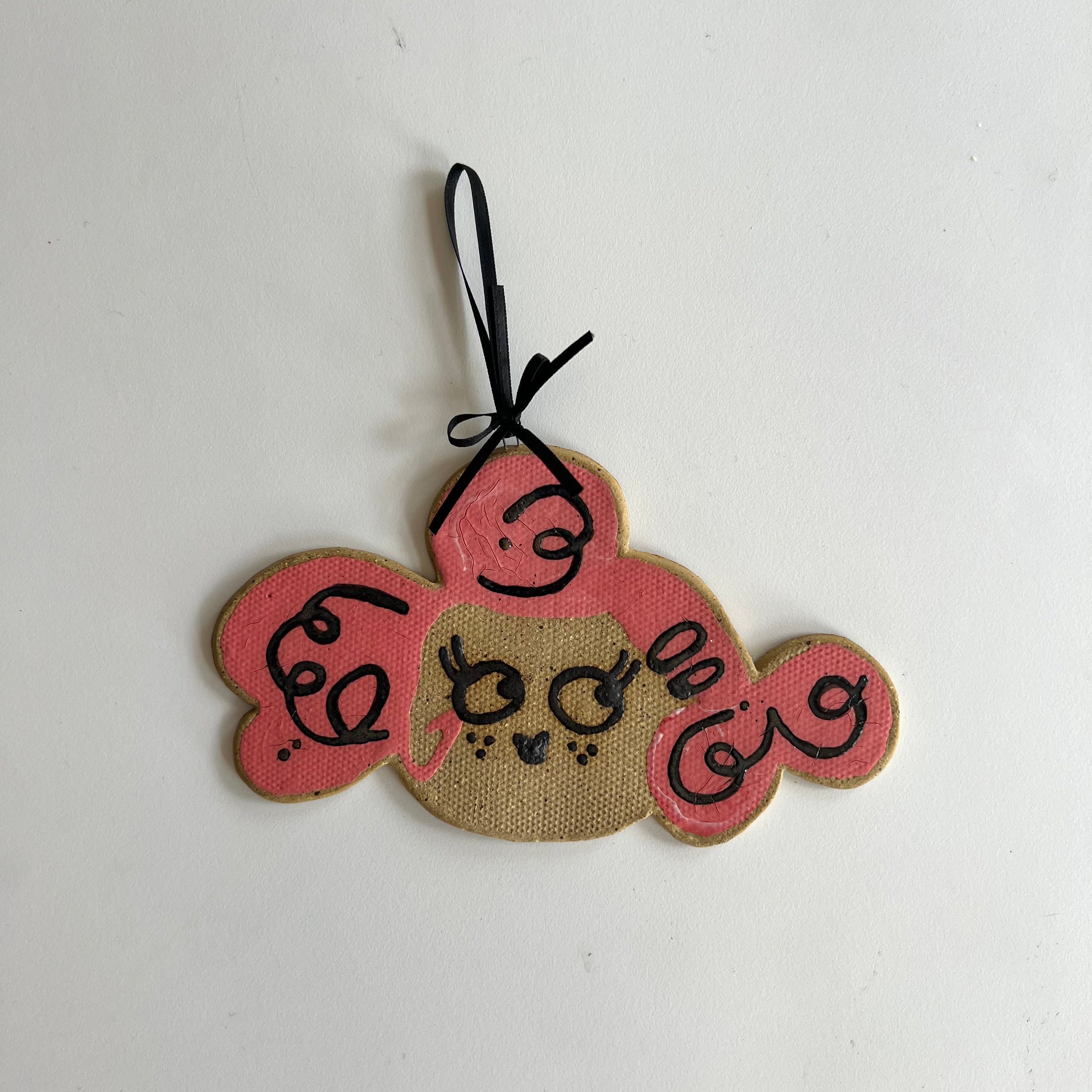 pink pooch ceramic wall hanging
