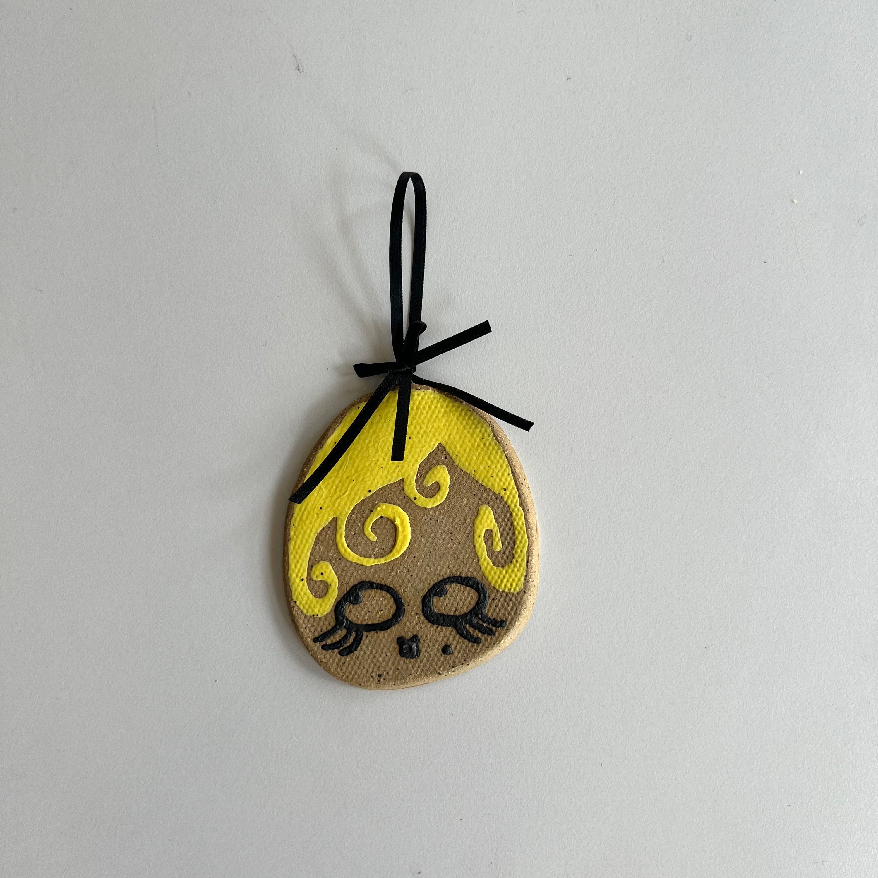 yellow pixie ceramic wall hanging