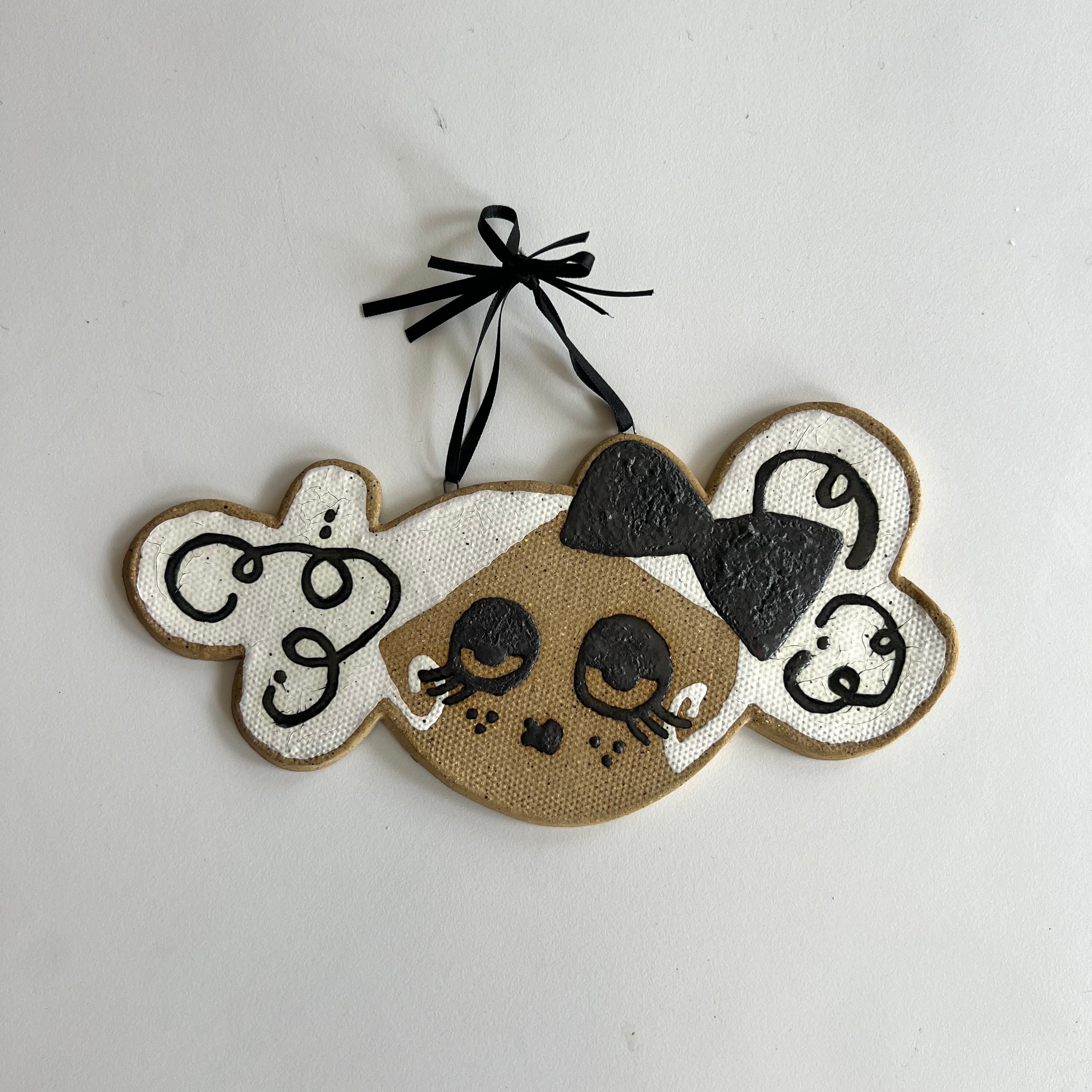 big white bow ceramic wall hanging