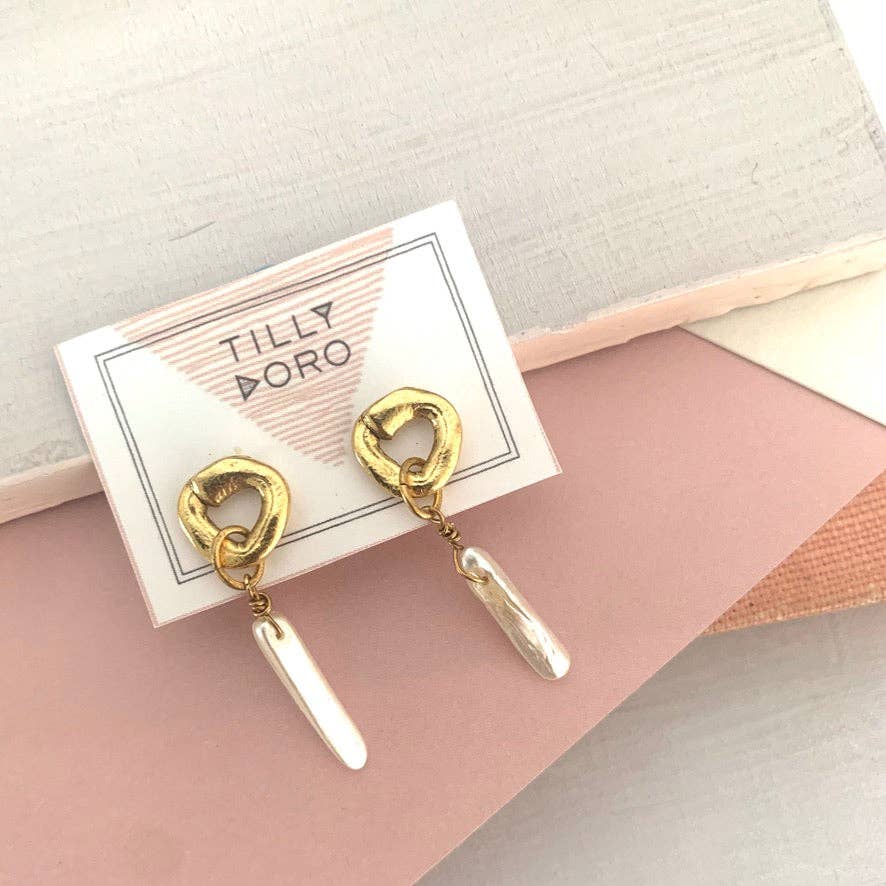 Cycles with pearl drop earrings